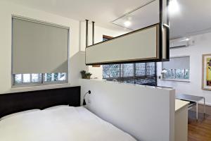 Postel nebo postele na pokoji v ubytování Hanasi 129 - Boutique Apartments