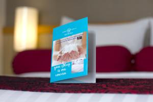 Postel nebo postele na pokoji v ubytování Ivory Hotel Bandung