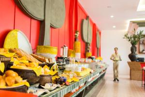 a buffet line with food on display in a store at Golden Temple Villa in Siem Reap