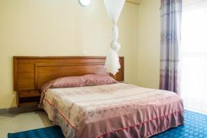 Кровать или кровати в номере Pelikan Hotel