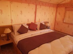 Postel nebo postele na pokoji v ubytování Sultan Resort