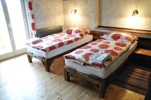 En eller flere senge i et værelse på Penzión Tokaj Ostrožovič