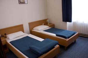 Postel nebo postele na pokoji v ubytování Hotel Veli Jože