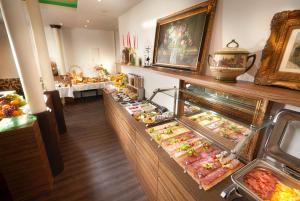 a buffet line with many different types of food at Hotel am Markt Bacharach in Bacharach