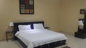 Кровать или кровати в номере Nozol Mena 109 by Al Azmy