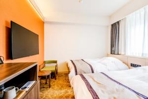 Телевизор и/или развлекательный центр в Lectore Atami Koarashi - TKP Hotels & Resorts