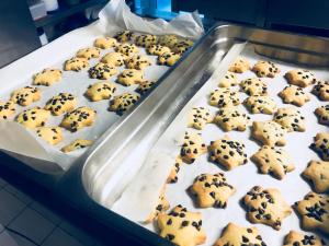 a tray of chocolate chip cookies on a baking sheet at Hotel Principe di Piemonte in Rimini