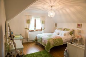 a bedroom with a bed and a window at Cherrytree House B&B in Moville