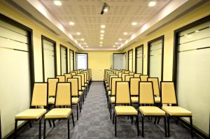 a row of chairs in a room at Golden Crown Old City Hotel in Nazareth