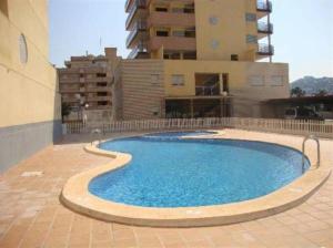 Bazén v ubytovaní Apartamentos Deluxe Pompeya 3 alebo v jeho blízkosti