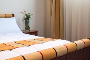Postel nebo postele na pokoji v ubytování Appia Antica Hotel