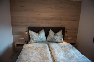 Un pat sau paturi într-o cameră la Haus Christine