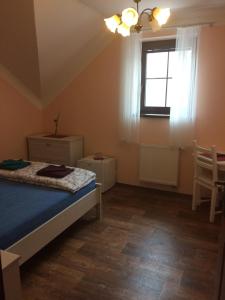 Postel nebo postele na pokoji v ubytování Penzion Pulčínské Skály