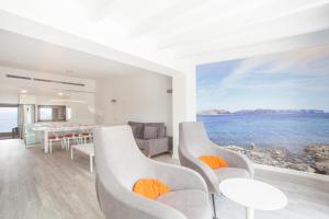 a living room with a view of the ocean at Aixa in Alcudia