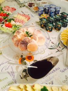 a table topped with plates of food and drinks at Dvůr Olšiny -Hotel and Horse-riding in Karviná