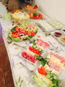 a table with many different types of food on it at Dvůr Olšiny -Hotel and Horse-riding in Karviná