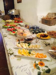 a table with many plates of food on it at Dvůr Olšiny -Hotel and Horse-riding in Karviná