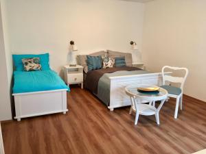 מיטה או מיטות בחדר ב-Penzion U Kapra