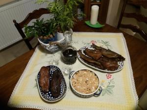 a table with two plates of food on a table at Apartamentypomorze in Białogóra