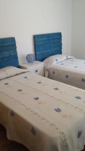 two beds sitting next to each other in a room at Playa de Consolaçao in Consolacao