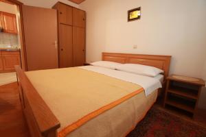 Postel nebo postele na pokoji v ubytování Apartments Nada