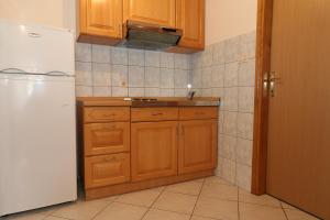 Kuchyň nebo kuchyňský kout v ubytování Apartments Nada