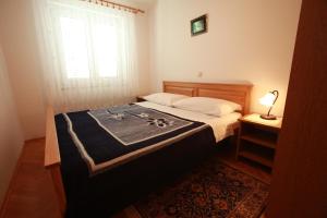Postel nebo postele na pokoji v ubytování Apartments Nada