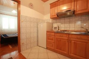 Kuchyň nebo kuchyňský kout v ubytování Apartments Nada