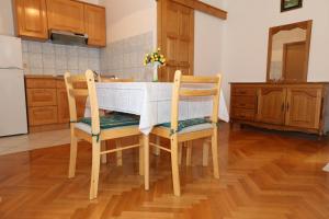Kuchyň nebo kuchyňský kout v ubytování Apartments Nada