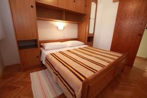 Postel nebo postele na pokoji v ubytování Apartments Nada