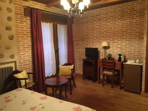 A bed or beds in a room at El Barondillo