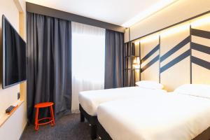 Ліжко або ліжка в номері ibis Styles Geneve Palexpo Aeroport