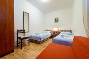Postel nebo postele na pokoji v ubytování Apartments Garden Beach Superior