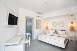 Cama ou camas em um quarto em Blue Sand Boutique Hotel & Suites