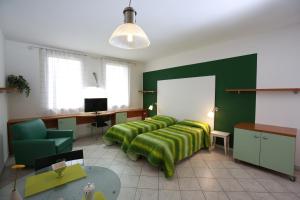 TV a/nebo společenská místnost v ubytování Villa Meli Lupi - Residenze Temporanee