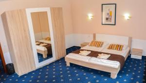 Posteľ alebo postele v izbe v ubytovaní Garni Hotel Tatramonti