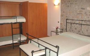 Postel nebo postele na pokoji v ubytování Residence Buca di Bacco