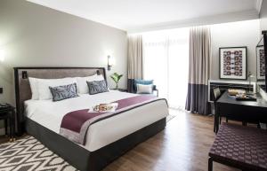 Avani Gaborone Resort & Casino客房内的一张或多张床位