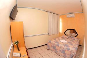 Ένα ή περισσότερα κρεβάτια σε δωμάτιο στο Pousada Ferreira +58 φωτογραφίες