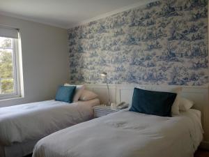 Ein Bett oder Betten in einem Zimmer der Unterkunft Hotel Isla Seca