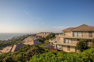 an aerial view of a building and the ocean at 1 Ezulweni in Ballito