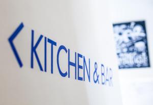 a sign that says kigeramine on a wall at Toc Hostel Madrid in Madrid