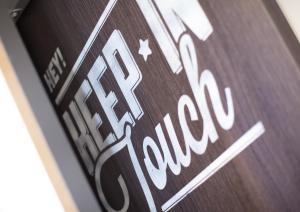 a close up of a sign that says new horizons at Toc Hostel Madrid in Madrid