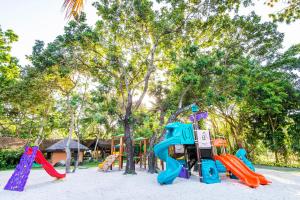 a playground with a bunch of slides and play equipment at Tivoli Ecoresort Praia do Forte in Praia do Forte