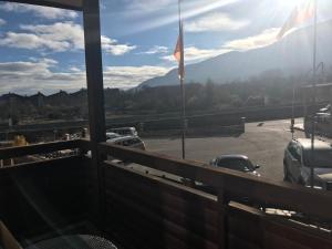 a balcony with a view of a parking lot at Apartment in Downtown Complex Bansko in Bansko