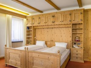 Postel nebo postele na pokoji v ubytování Hotel Alpina