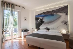 Postel nebo postele na pokoji v ubytování Hotel Barracuda + 29 fotografií