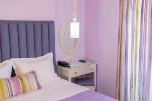 Кровать или кровати в номере WhiteSands Beach Resort