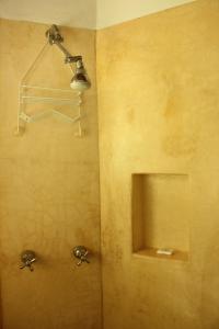 a shower with a light in a bathroom at Casa Del Sol in Lo de Marcos
