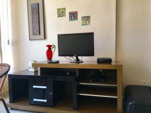 Μια τηλεόραση ή/και κέντρο ψυχαγωγίας στο Férias na praia de Ponta Verde